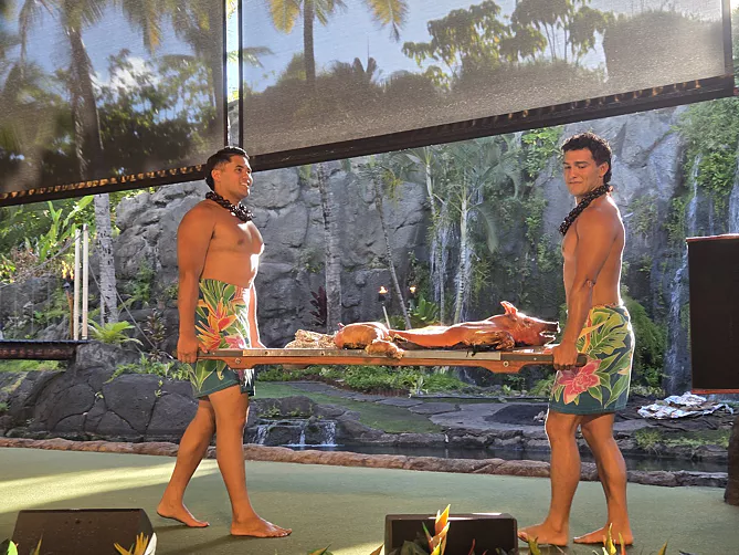 Performers in colorful costumes during an outdoor cultural performance